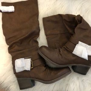 Brown riding boots. Never worn.